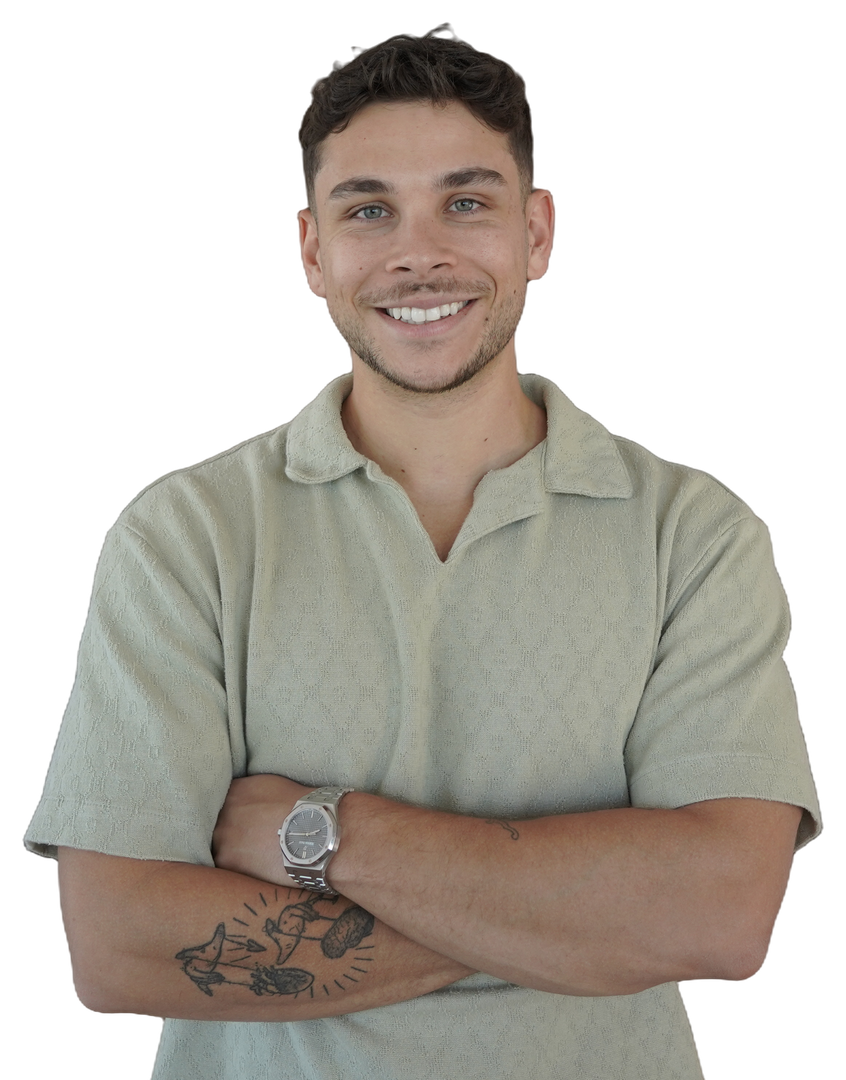 Nathan Nazareth, arms folded, in a light green shirt